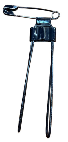 Black hair clip on a wooden surface