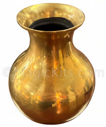 Gold vase on a wooden surface