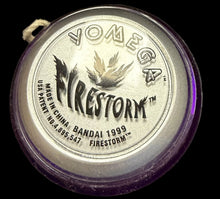 Silver container with 'Omega' branding on a map background
