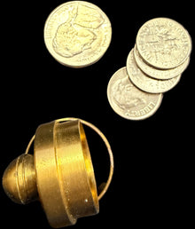Gold spiral object and coins on a map background