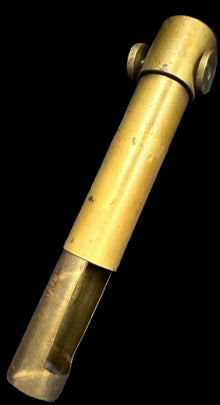 Brass whistle on a world map background