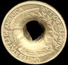 Close-up of a brass button on a textured surface with a map background