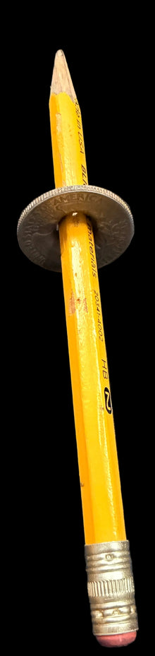 Pencil with eraser on a map-themed surface