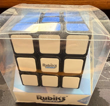 Rubik's cube in a clear plastic bag on a dark surface