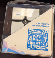 Product packaging with a QR code on a dark surface