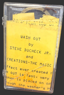 Vintage cassette tape with yellow label on a textured surface