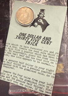 Coin trick package with instructions and a coin on a dark background