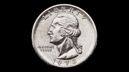 Silver coin with a profile of a person and 'Liberty' text on a black background