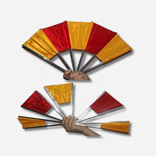 Two hands holding open red and yellow flags on a white background