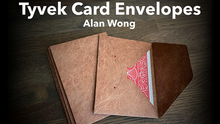 Brown Tyvek card envelopes with a red design on a wooden surface, branded 'Alan Wong'.