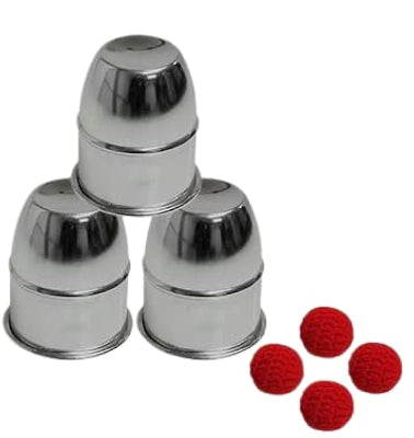 Set of metallic cups with red crochet balls on a white background