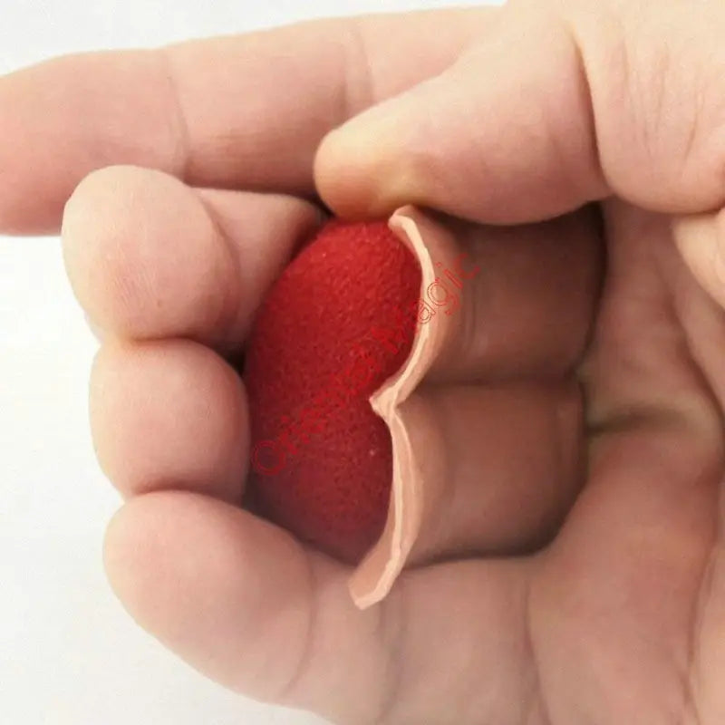 Hand squeezing a red stress ball against a white background
