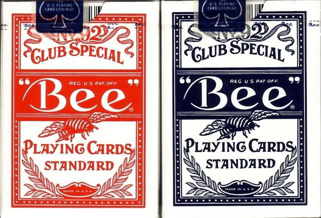 Two packages of Bee Club Special playing cards, one red and one blue, on a white background.