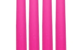 Four bright pink candles of equal size on a white background