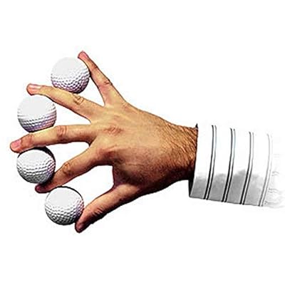 Hand holding four golf balls with a white background