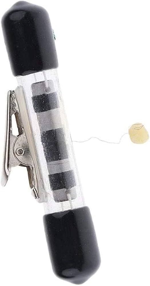 Clear plastic clip with black ends on a white background