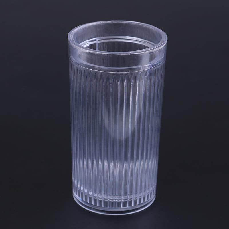 Clear plastic tumbler with ribbed design on a black background