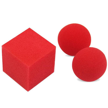 Red foam cube and two red foam balls on a white background