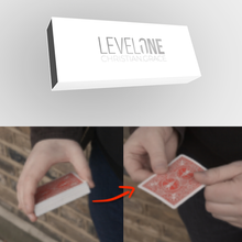 Level One card box with hands holding playing cards on a gray background