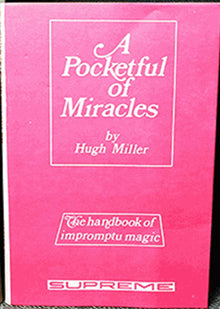 Pink book titled 'A Pocketful of Miracles' by Hugh Miller among vintage books.