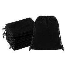 Multiple black drawstring bags on a white background