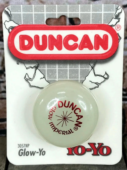 Glow-in-the-dark yo-yo on a Duncan branded card with a grid background