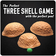 Three shell game with a green ball on a black background