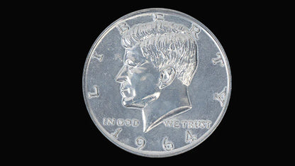 Silver coin with a profile of a person and 'In God We Trust' text on a black background