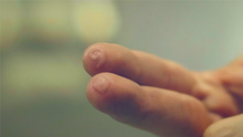 Close-up of a person's hand with a blurred background