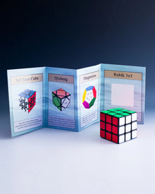 Rubik's Cube and other puzzle cubes with a display card on a dark background