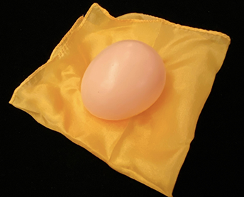 Pink egg on a yellow square with a black background