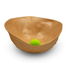 Large half walnut shell with a pea in the shell o0n a white background.
