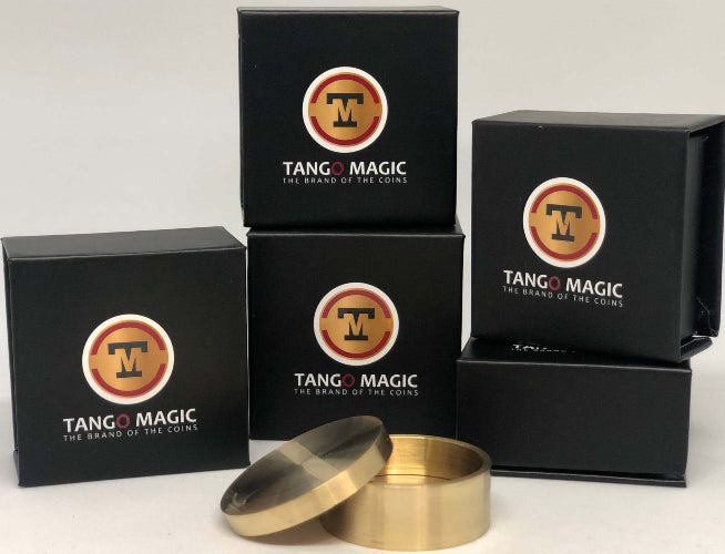 Stacked boxes that say Tango Magic On them.  In front is a Brass container with lid
