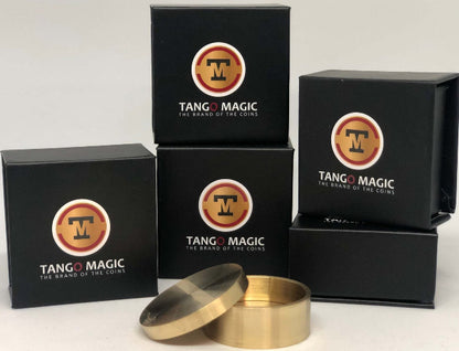 Stacked boxes that say Tango Magic On them.  In front is a Brass container with lid