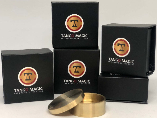 Set of black boxes with Tango Magic logo and two brass containers on a white background