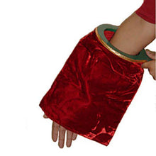 Red velvet glove held by a person on a white background