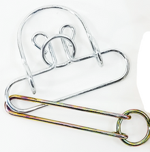 Metal puzzle with packaging labeled 'Old Time Puzzle' on a white background