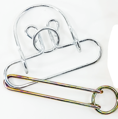 Metal puzzle with packaging labeled 'Old Time Puzzle' on a white background