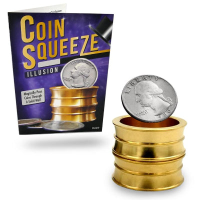 Gold coin squeeze illusion with a coin on top, next to its packaging.