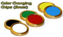 Color-changing chips in brass with green, red, yellow, and blue centers on a white background.