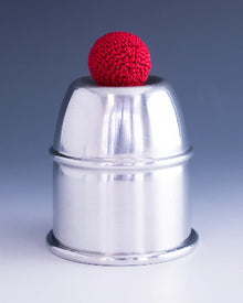 Metallic container with a red ball on top against a gray background