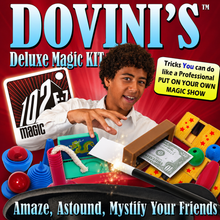 Promotional graphic for Dovini's Deluxe Magic Kit, featuring a young boy performing magic tricks with various colorful props including a dollar bill, a wooden box, and spinning tops against a red background with large blue text.
