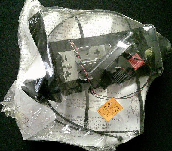 Electrical component in a clear plastic bag on a black background