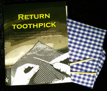 Booklet titled 'Return Toothpick' with toothpicks on a checkered cloth against a dark background