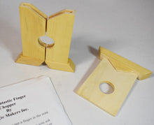 Wooden finger chopper toy with packaging on a white background