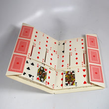 Folded deck of playing cards on a white background