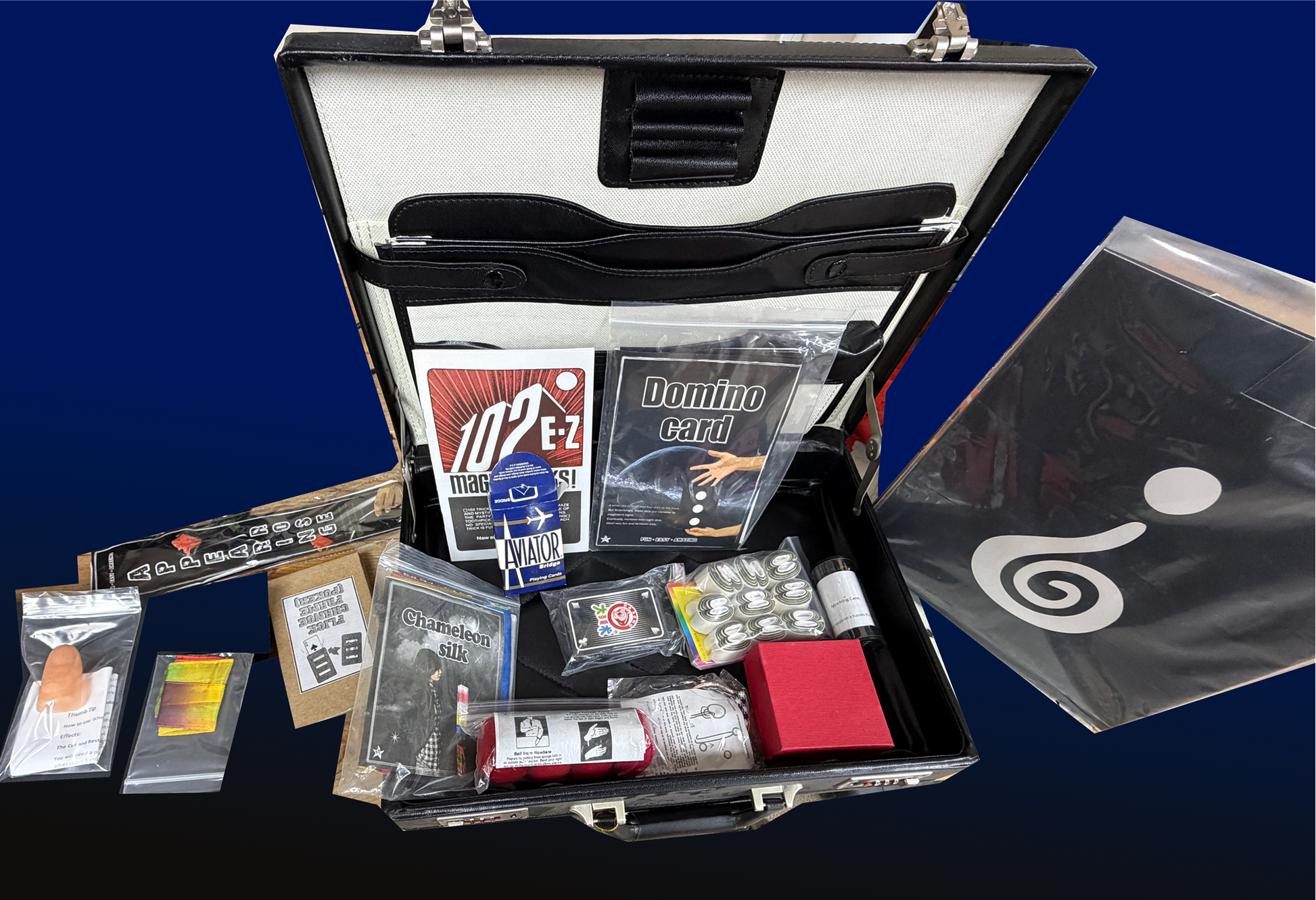 Open briefcase with various items including cards and a box on a blue background