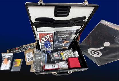 Open briefcase with various items including cards and a box on a blue background