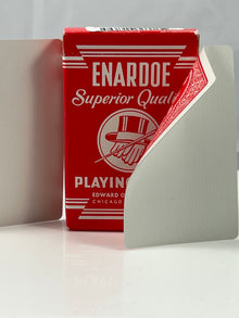 Red Enardoe playing card box on a white surface with a gray background