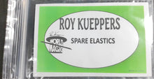 Packaged spare elastics with Roy Kueppers branding on a black background